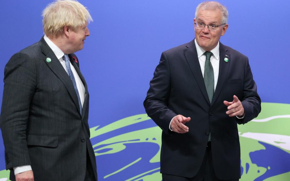 Boris Johnson greets Scott Morrison, the Australian Prime Minister, as leaders arrive for Cop26 - Robert Perry/EPA-EFE/Shutterstock