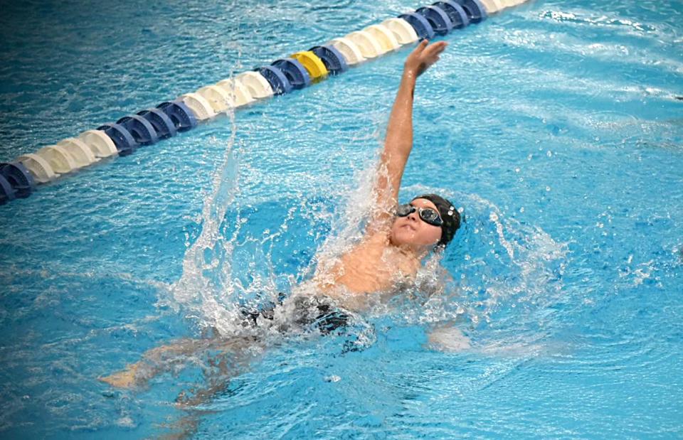 Cooper Hart swims in the 100 backstroke event at the Zones Championships for the Stingrays.