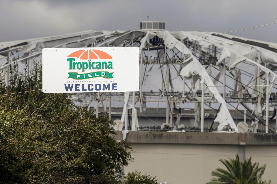 A ‘welcome’ sign sits the entrance to the parking lot of St. Petersburg’s Tropicana Field on Thursday morning. The western Florida facility’s roof was torn off by Hurricane Milton. ((AP Photo/Mike Carlson))