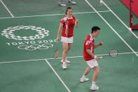 China's Zheng Si Wei, right, and Huang Ya Qiong celebrate after defeating Hong Kong's Tang Chun Man and Tse Ying Suet during their mixed doubles semifinal matchat the 2020 Summer Olympics, Thursday, July 29, 2021, in Tokyo, Japan. (AP Photo/Dita Alangkara)