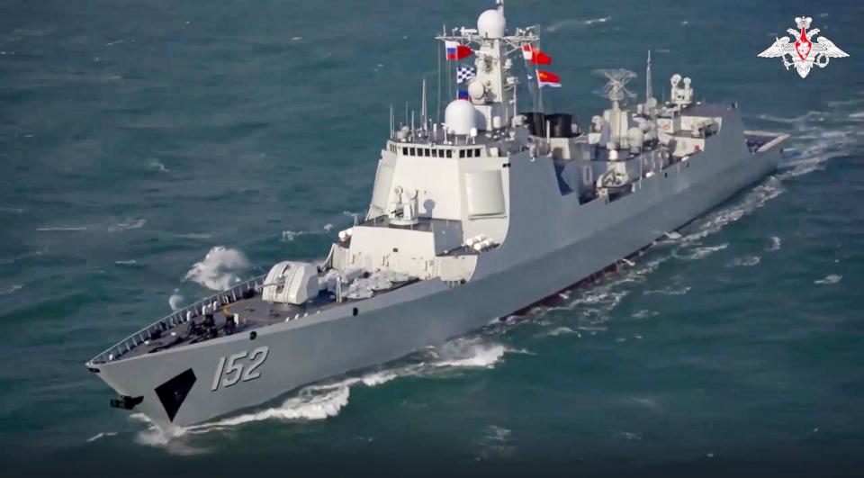 In this handout photo taken from video released by Russian Defense Ministry Press Service on Thursday, Dec. 22, 2022, The Chinese destroyer Jinan takes part in joint naval drills with Russia in the East China Sea on Thursday. The exercise showcases increasingly close defense ties between the two countries as they both face tensions with the United States. (Russian Defense Ministry Press Service via AP)
