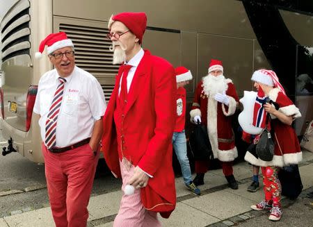 People dressed as Santa Claus take take part in the World Santa Claus Congress, an annual event held every summer in Copenhagen, Denmark, July 25, 2017. REUTERS/Stine Jacobsen