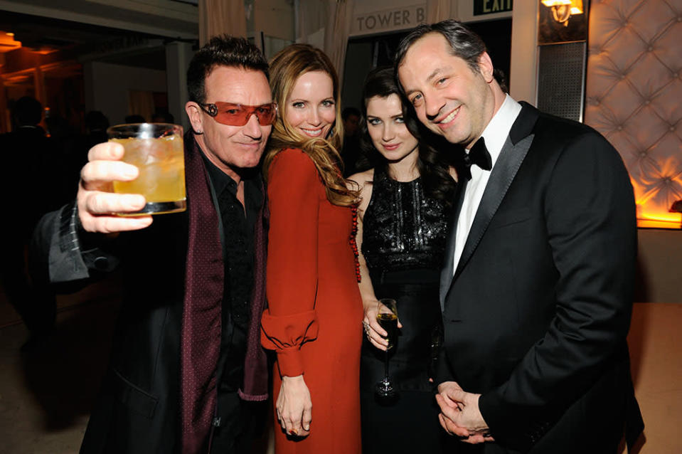 Bono, Eve Hewson, Leslie Mann, and Judd Apatow attend the 2013 Vanity Fair Oscar Party hosted by Graydon Carter at Sunset Tower on February 24, 2013 in West Hollywood, California.