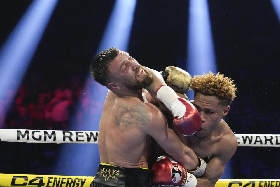 Devin Haney, right, fights Vasiliy Lomachenko in an undisputed lightweight championship boxing match Saturday, May 20, 2023, in Las Vegas. Haney won by unanimous decision. (AP Photo/John Locher)