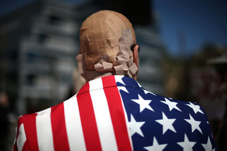 Mike Stutz is seen with his head covered in band aids to protest against President Trump's proposed replacement for Obamacare in Los Angeles, California, U.S., March 14, 2017. REUTERS/Lucy Nicholson