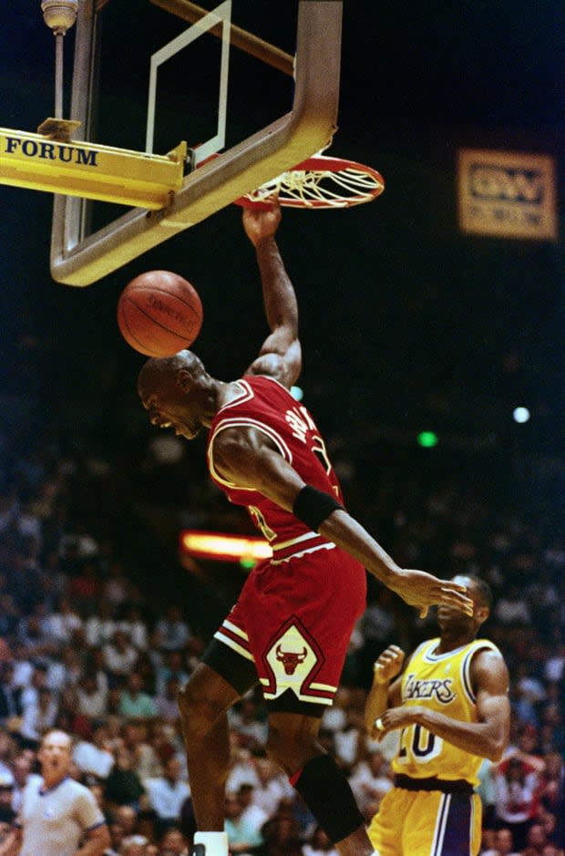 Michael Jordan slam dunks during the NBA Finals in June 1991.<p>Bettman/Getty Images</p>