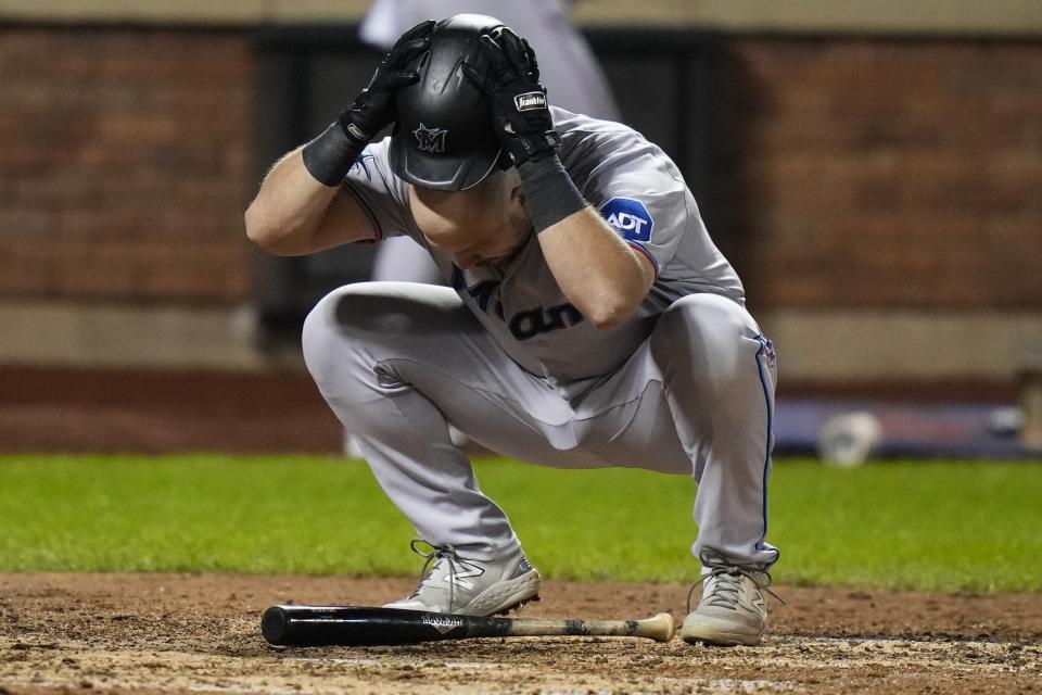 Miami Marlins' Jake Burger reacts to a call after striking out during the seventh inning in the second baseball game of a doubleheader against the New York Mets, Wednesday, Sept. 27, 2023, in New York. (AP Photo/Frank Franklin II)