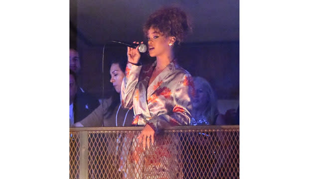 Rihanna went all out for her stylist Sonya Benson's New York City wedding this weekend! The "B**ch Better Have My Money" singer's good gal pal married James Markey, and while RiRi didn't attend the ceremony, she was on hand to perform at the party! <strong> PHOTOS: Rihanna Posts a Pic of Her New '1988' Tattoo -- See the Ink! </strong> Rihanna wore a kimono-like, silk lavender and red floral wrap dress for her friend's big day. The 2015 MTV Video Music Awards nominee paired the getup with silver stiletto sandals. An insider at the event told ET that Rihanna performed a few songs from the balcony overlooking the crowd at American Whiskey in New York City's Midtown neighborhood. During her performance, a slideshow of pictures of the couple was displayed. The 27-year-old pop star, who stayed at the party for a few hours, also said a few sweet words about the newlyweds. 247PapsTV <strong> MORE: Rihanna Parties With Lewis Hamilton in Scantily-Clad Costume at Barbados' Crop Over Celebration </strong> "Yasss!!!! Congrats to my beautiful and crazy @sonyabens on tying da knot!!!" RiRi Instagrammed along with a pic of the bride on her cell phone. "F**king love you girl!!! James you the real mvp doe!" <strong> WATCH: Alex Trebek Kinda Sorta Singing Rihanna's 'Umbrella' Makes Us Extremely Uncomfortable </strong> Rihanna already proved she was great at weddings when she served as a bridesmaid for her assistant Jennifer Morales' Hawaii nuptials in April. Check out her stunning purple gown: And if you think Rihanna's wedding style is wild, you should see what she wore to Barbados' Kadooment Day parade earlier this month!