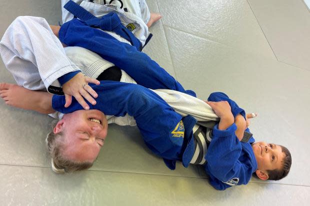 Zena Sworder with one of the young students in an early morning bout