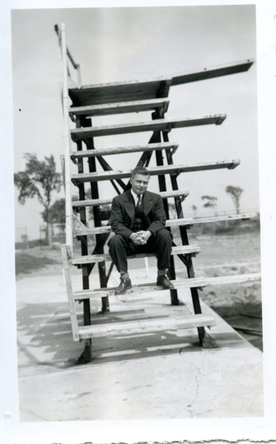 Alvah C. Card, who worked for the Portsmouth Public Works Department, sits by the newly-built Peirce Island Pool's diving board on June 5, 1938.