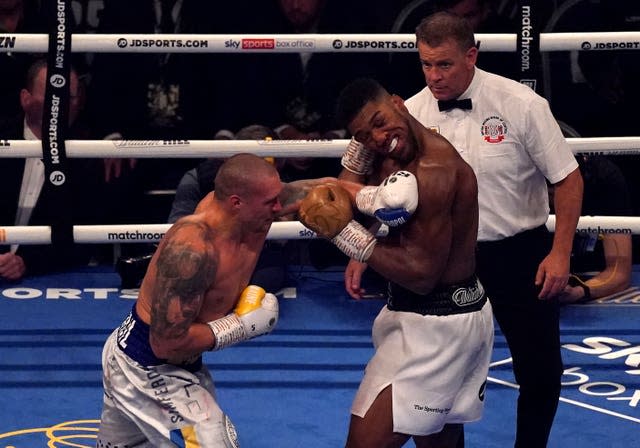 Usyk, left, staggered his opponent on several occasions (Nick Potts/PA)