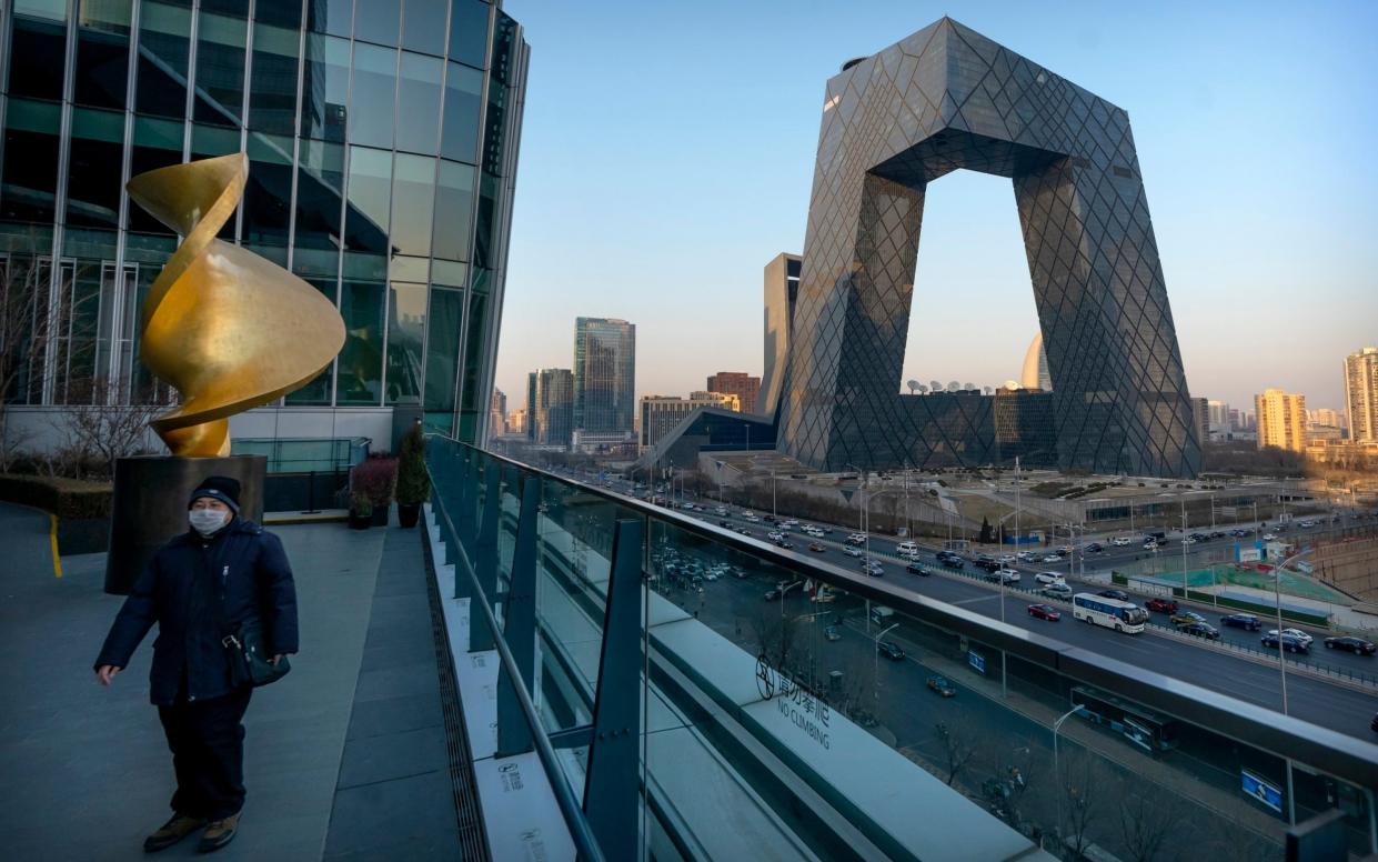 The CCTV headquarters in Beijing, the home of China's state-run TV network - AP