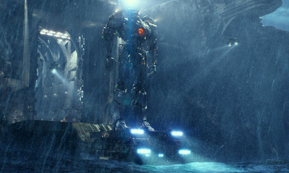 This film publicity image released by Warner Bros. Pictures shows the Gipsy Danger robot in a scene from "Pacific Rim." "Pacific Rim" fulfills a very basic boyhood fantasy: big ol' robots and giant monsters slugging it out. The concept to Guillermo del Toro's "Godzilla"-sized film is about as simple as it gets, but actually constructing such mammoth creations is a far more arduous undertaking. (AP Photo/Warner Bros. Pictures)