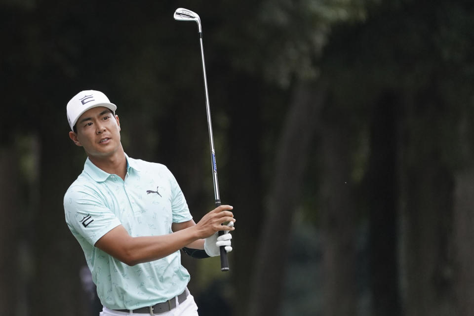 Justin Suh of the United State hits a shot on the seventeenth hole in the third round of the PGA Tour Zozo Championship at the Narashino Country Club in Inzai on the outskirts of Tokyo, Saturday, Oct. 21, 2023. (AP Photo/Tomohiro Ohsumi)