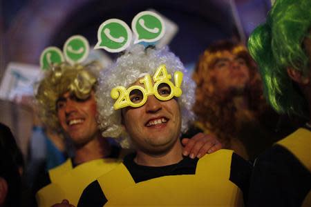 Revellers take part in New Year's celebrations in Coin, near the southern Spanish town of Malaga, early January 1, 2014. REUTERS/Jon Nazca