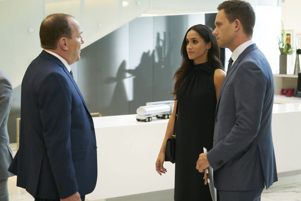 Meghan Markle as Rachel Zane stands beside Patrick J. Adams as Mike Ross in “Suits.” (Photo: Ian Watson/USA Network)