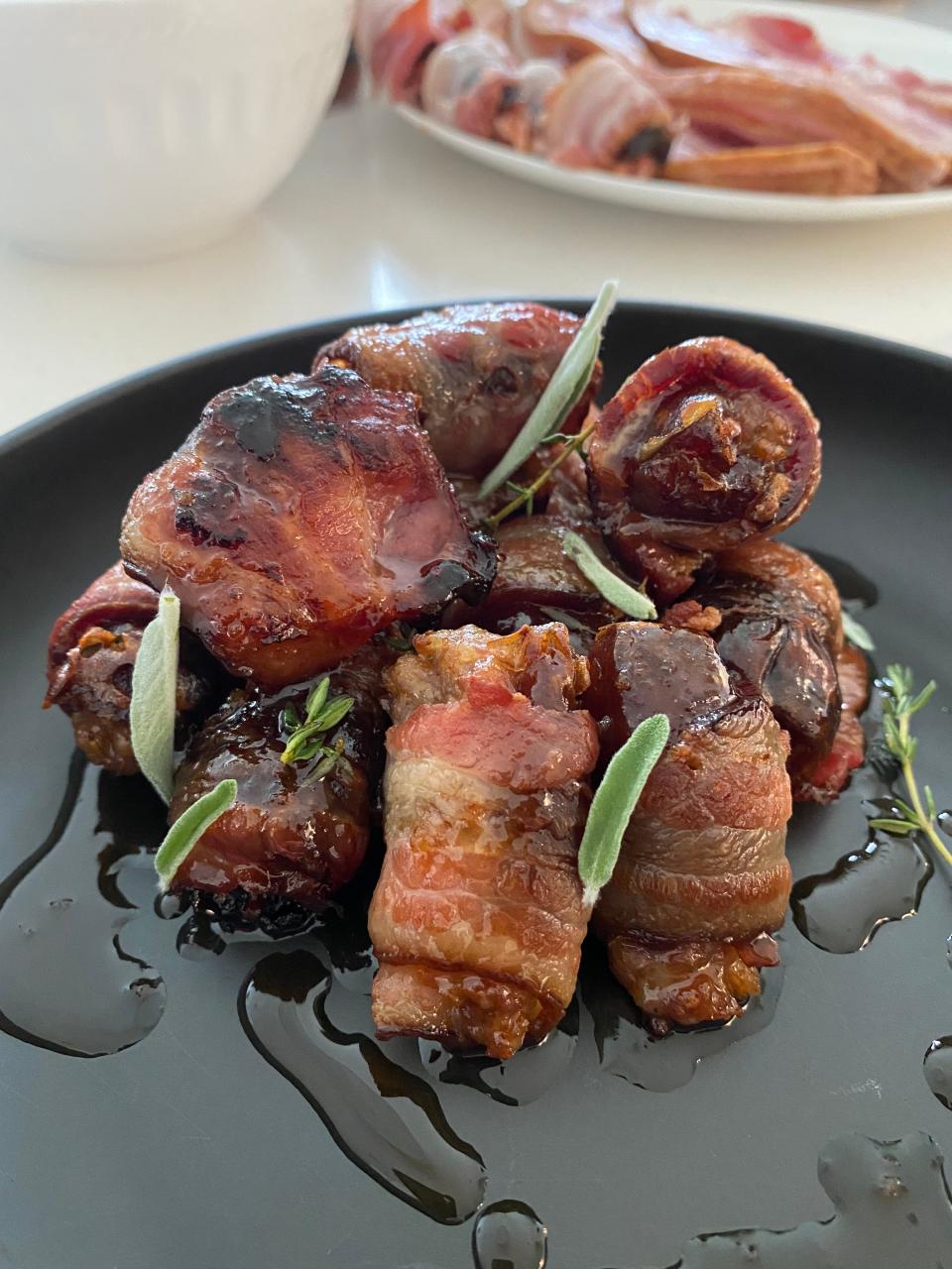 The combination of maple syrup sweet and hints of heat from the It Sauce add depth of flavors to these bacon-wrapped, sausage-stuffed dates.