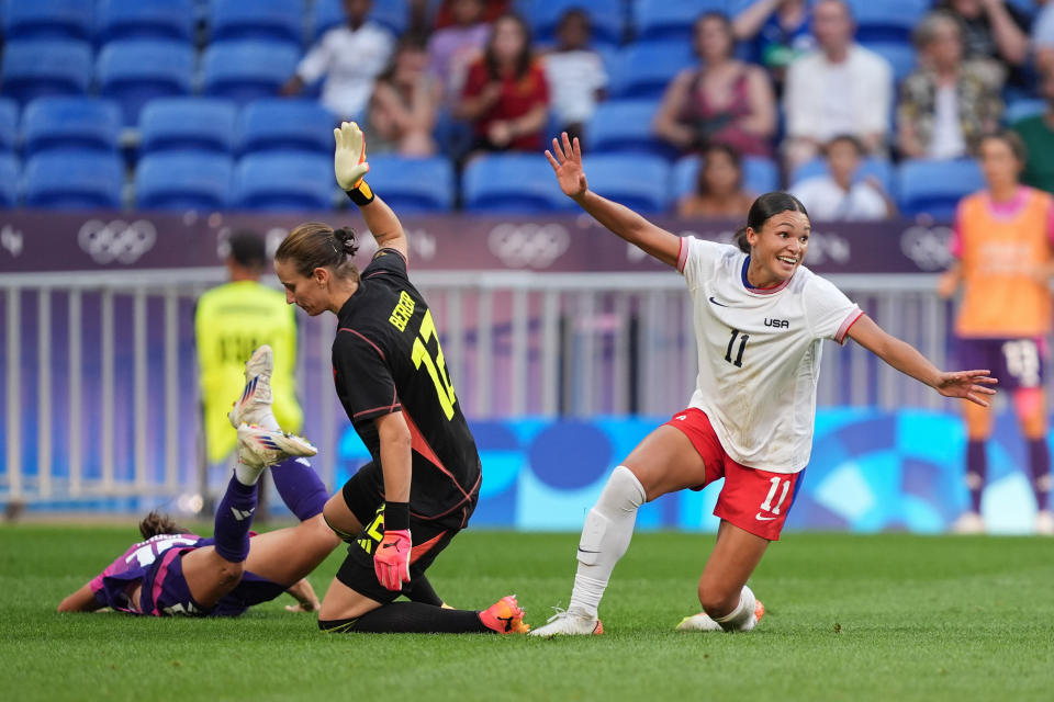 Smith celebrates her game-winner. (Andrea Vilchez/ISI/Getty Images)