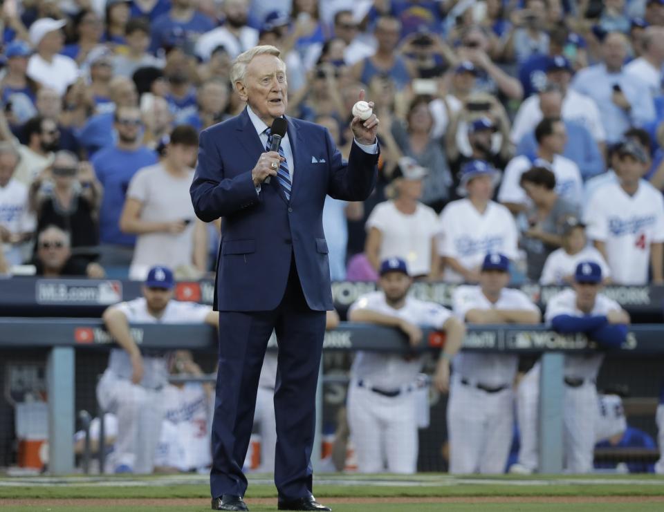 <p>Vin Scully helps throw out the ceremonial first pitch before Game 2 of baseball’s World Series between the Houston Astros and the Los Angeles Dodgers Wednesday, Oct. 25, 2017, in Los Angeles. (AP Photo/David J. Phillip) </p>