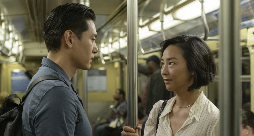 This image released by A24 shows Teo Yoo, left, and Greta Lee in a scene from "Past Lives." (Jon Pack/A24 via AP)