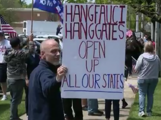 Protester holds disturbing sign at anti-lockdown rally (News 12 Long Island)