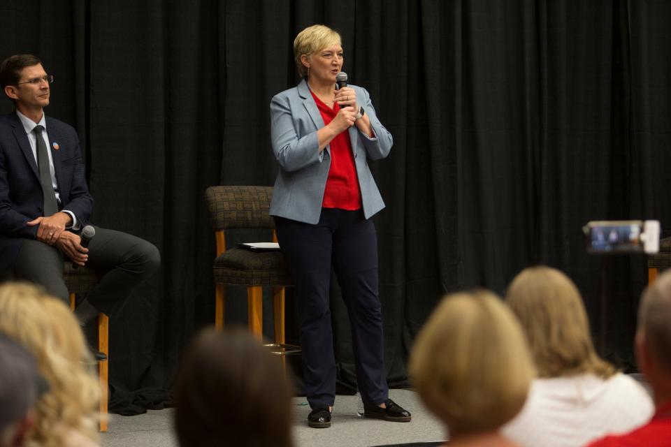 Republican candidate Kristy Pike speaks during a debate at the Dixie Convention Center on Tuesday, May 17, while her opponent, Neil Walter looks on. The two are vying for the Republican nomination to represent Utah House District 74, which includes much of the western side of Washington County.