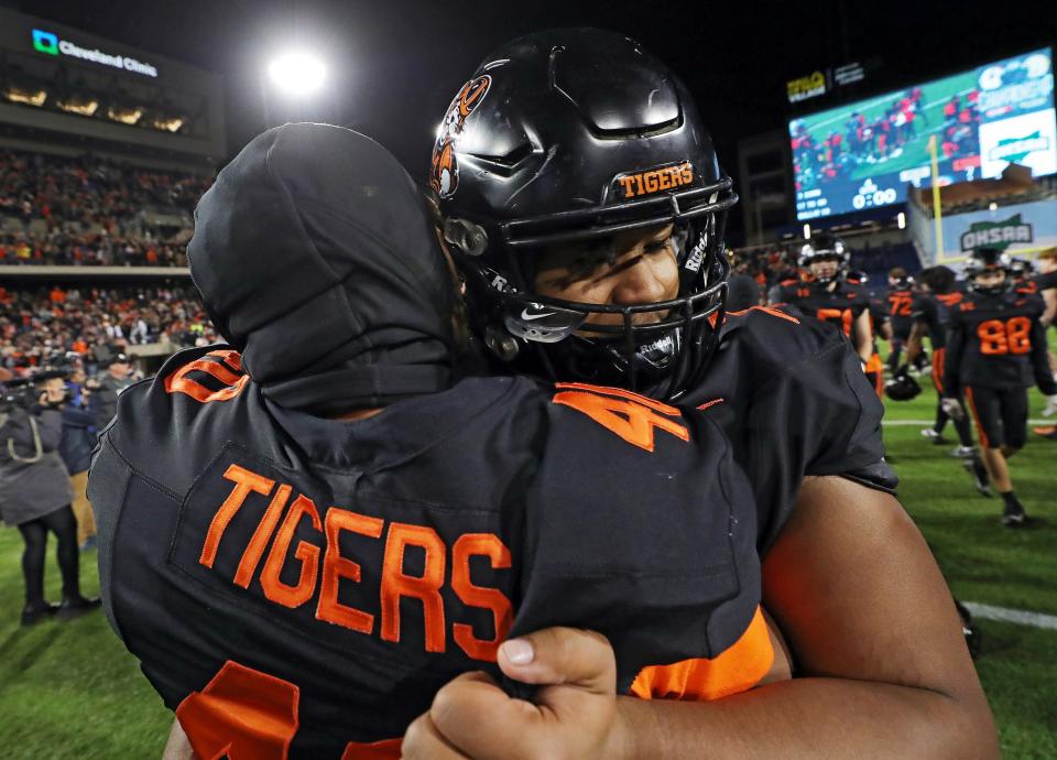 Massillon players celebrate their OHSAA Division II state championship, Thursday, in Canton.