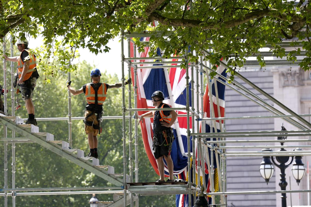 Building work in preparation for the Platinum Jubilee celebrations take place in front of Buckingham Palace in London on Friday, May 6, 2022. Britain's Queen Elizabeth II ascended to the throne after the death of her father King George VI on Feb. 6, 1952, and the Platinum Jubilee bank holiday weekend celebrations will take place on June 2 to June 5, 2022.