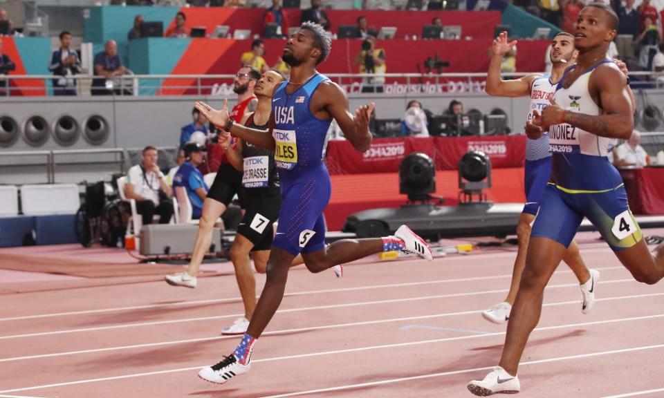 Noah Lyles celebrates after crossing the line