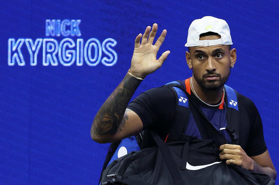 Nick Kyrgios (pictured) waves the US Open crowd as he enters court.