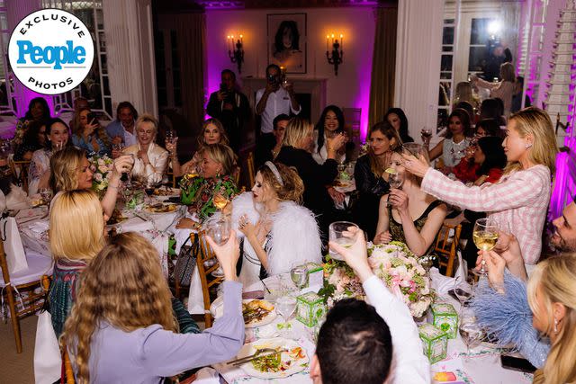 <p>Kevin Ostajewski</p> Guests toast to Kathy Hilton.