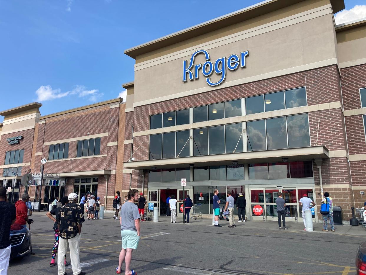 People wait outside Kroger in Corryville on June 14 afrer the store was evacuated for a bomb threat. It was the seventh bomb threat to the locally headquartered supermarket chain's stores in Greater Cincinnati. No bombs were found at any of the stores.