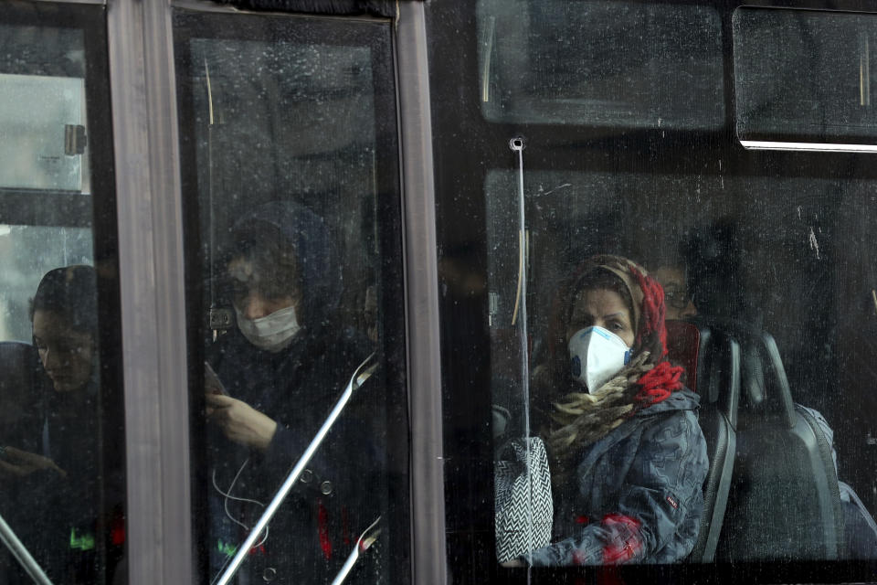 People wear masks to help guard against dangerous levels of air pollution in Tehran, Iran, Monday, Dec. 23, 2019. Poor air quality forced Iran’s government on Monday to keep all schools closed in the capital, Tehran, and other cities. Schools were closed since Saturday, and will remain closed until Wednesday, the end of the week in Iran, according to the official IRNA news agency. Tehran’s air is among the most polluted in the world. (AP Photo/Ebrahim Noroozi)