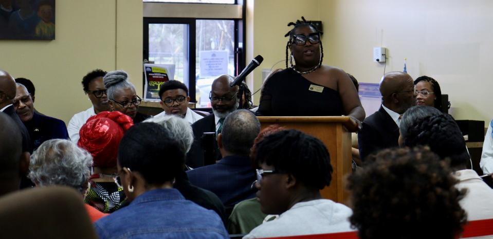 LaKeisha Henton, manager of the Rapides Parish Library Martin Luther King Jr. branch, welcomes people on Saturday to the grand opening of the Central Louisiana African American Culture & Heritage Center.