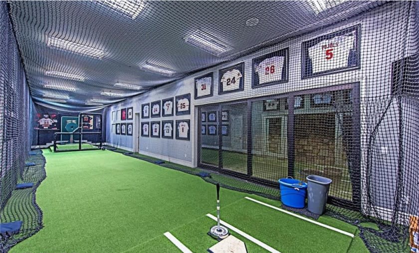 Custom-built in 2011, the three-story home features a movie theater, wine cellar, game room and indoor batting cage across 11,000 square feet.