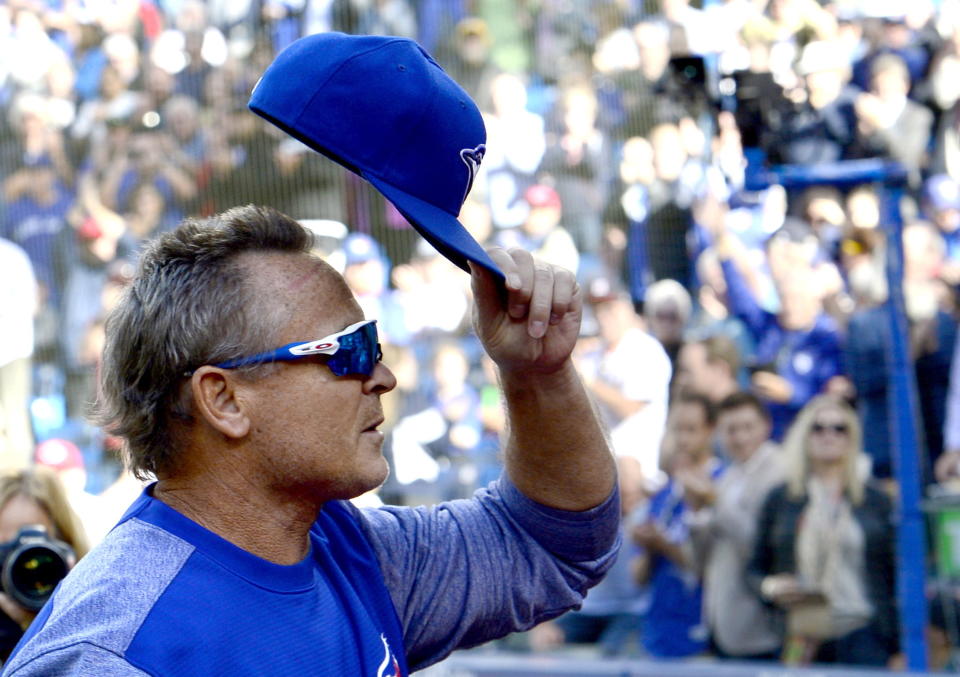 Toronto Blue Jays manager John Gibbons tips his cap to the crowd as he walks off the field before before the start of a baseball game against the Houston Astros in Toronto on Wednesday Sept. 26, 2018. Gibbons is moving on from his job as manager of the Blue Jays at the end of the season. (Frank Gunn/The Canadian Press via AP)