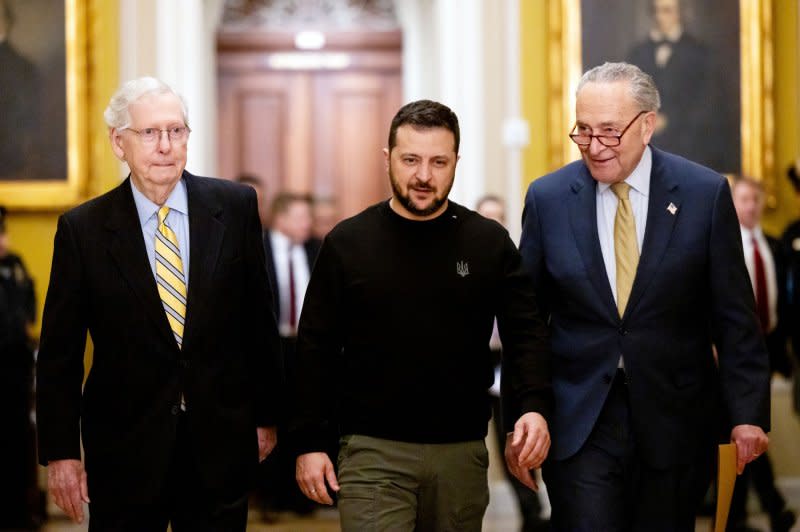 Left to right, Senate Minority Leader Mitch McConnell, R-Ky., Ukrainian President Volodymyr Zelensky and Senate Majority Leader Chuck Schumer, D-N.Y., walk to a closed-door meeting at the U.S. Capitol in Washington on Tuesday. Photo by Julia Nikhinson/UPI