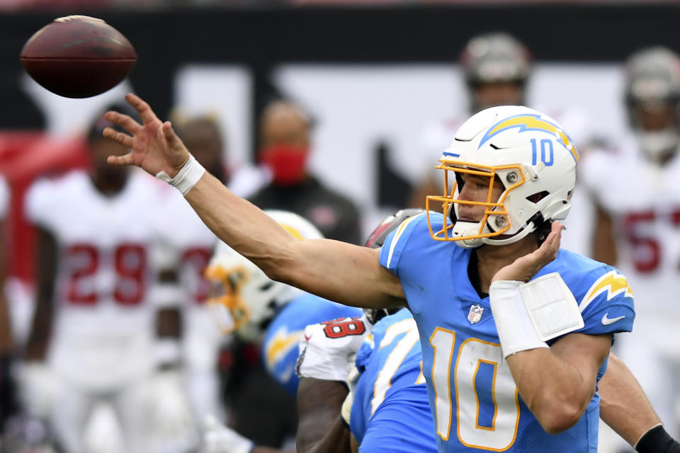 Los Angeles Chargers quarterback Justin Herbert (10) fires a pass against the Tampa Bay Buccaneers during the first half of an NFL football game Sunday, Oct. 4, 2020, in Tampa, Fla. (AP Photo/Jason Behnken)