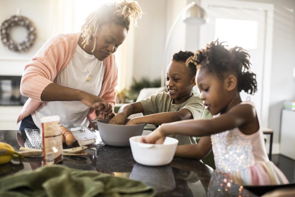 Mother, daughter and son baking