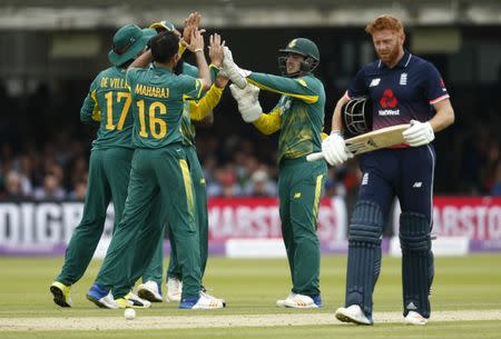 Britain Cricket - England v South Africa - Third One Day International - Lordâ€™s - 29/5/17 South Africa's Keshav Maharaj celebrates with team mates after taking the wicket of England's Jonny Bairstow Action Images via Reuters / Andrew Couldridge Livepic EDITORIAL USE ONLY.