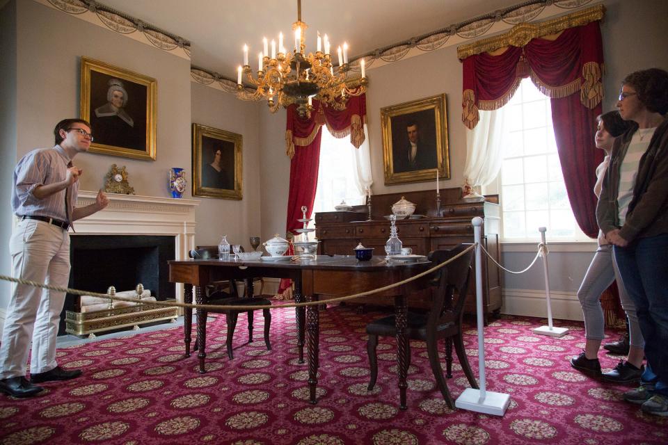 Benjamin Livengood leads a tour through the dining room of the James K. Polk Home & Museum on Monday, Oct. 23, 2017.