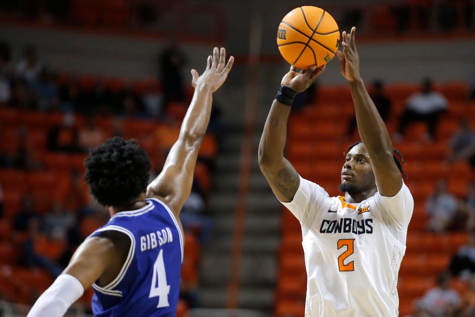 Oklahoma State guard Chris Harris Jr. attempts a shot over Texas-Arlington guard Kyron Gibson during a game at Gallagher-Iba Arena in Stillwater on Nov. 7, 2022.