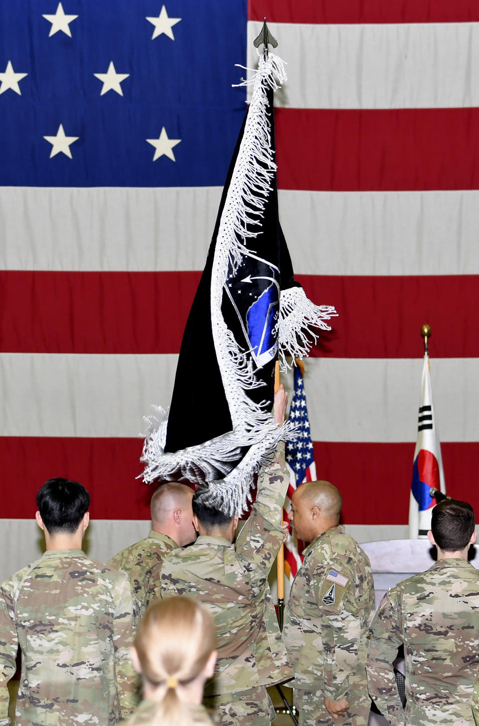 U.S. soldiers attend the activation ceremony for the United States Space Forces Korea in Pyeongtaek, South Korea Wednesday, Dec. 14, 2022. U.S. military set up space-monitoring organizations, United States Space Forces Korea, in South Korea, aiming to keep an eye on North Korea's nuclear and missile activity as its capabilities continue to improve. (Song Kyung-Seok/Pool Photo via AP)