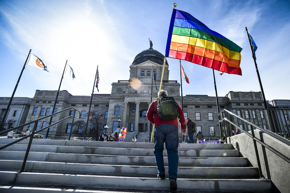 Demonstrators gather on the step of the Montana State Capitol protesting anti-LGBTQ+ legislation on March 15, 2021, in Helena, Mont. (Thom Bridge / Independent Record via AP file)