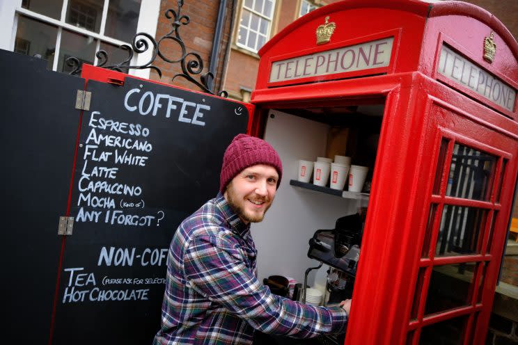 A coffee-loving businessman has opened what could be Britain's smallest cafe - inside a disused red phone box. 