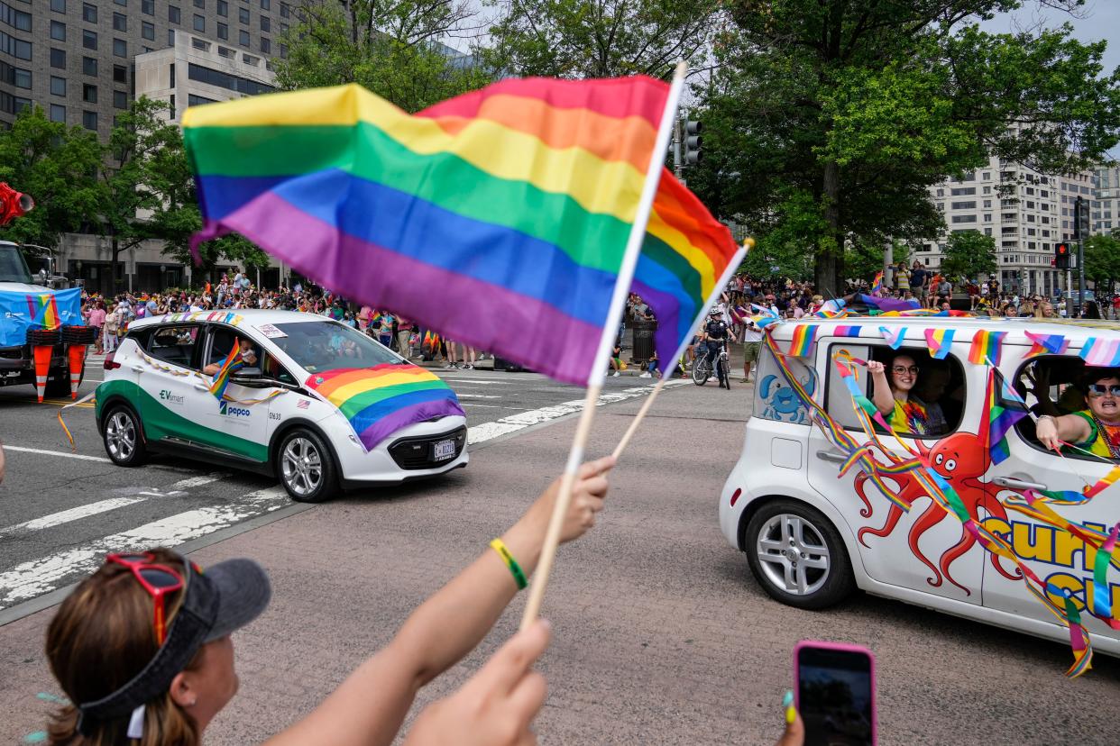 Members and allies of the LGBT+ community cheer on a Pride car parade as it leaves from Freedom Plaza on 12 June, 2021 in Washington, DC.  (Getty Images)