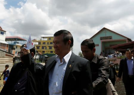 Kem Sokha (C), leader of the Cambodia National Rescue Party (CNRP), leaves after he registers for next year's local elections, in Phnom Penh, Cambodia October 5, 2016. REUTERS/Samrang Pring