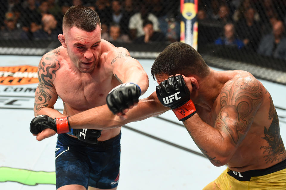 Colby Covington punches Rafael Dos Anjos of Brazil in their interim welterweight title fight during the UFC 225 event at the United Center on June 9, 2018 in Chicago, Illinois. (Getty Images)