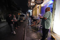 Patrons resume their socializing at Cuban Cigar Bar in the French Quarter in New Orleans, after power was restored Wednesday, Oct. 28, 2020. Hurricane Zeta passed through today leaving much of the city and metro area without power. (AP Photo/Gerald Herbert)