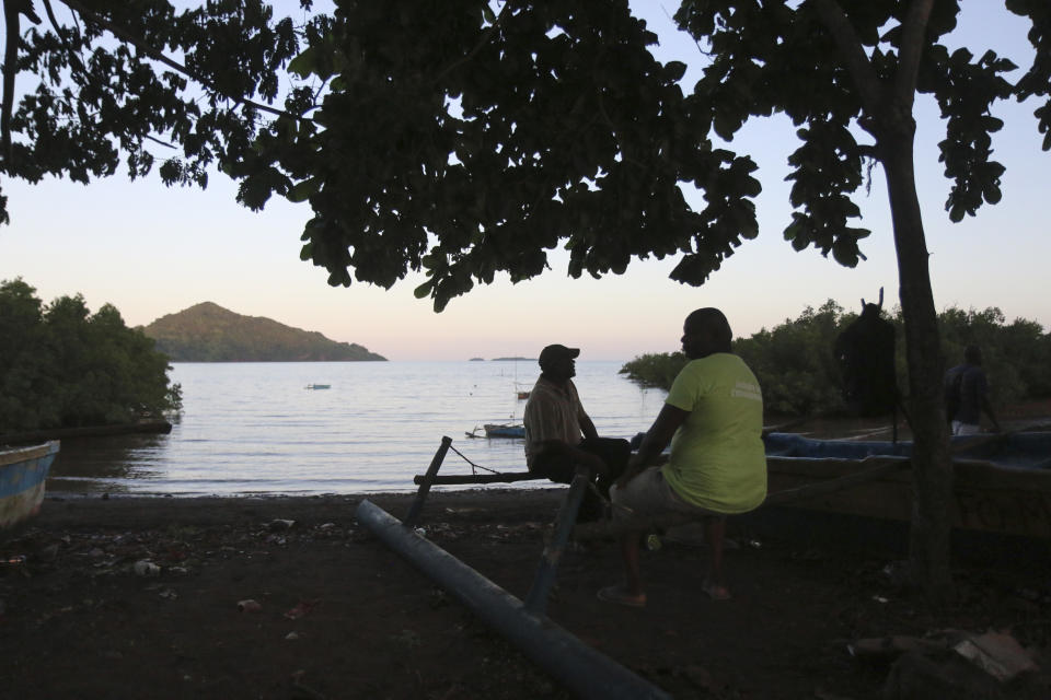 Fishermen relax after a work day in Assamainty, near Mamoudzou, in the French Indian Ocean territory of Mayotte, Thursday, April 27, 2023. France is facing a migration quagmire on the island territory of Mayotte off Africa’s east coast. The government sent in 2,000 troops and police to carry out mass expulsions, destroy slums and eradicate violent gangs. But the operation has become bogged down and raised concerns of abuse, aggravating tensions between local residents and immigrants from the neighboring country of Comoros. (AP Photo/Gregoire Merot)